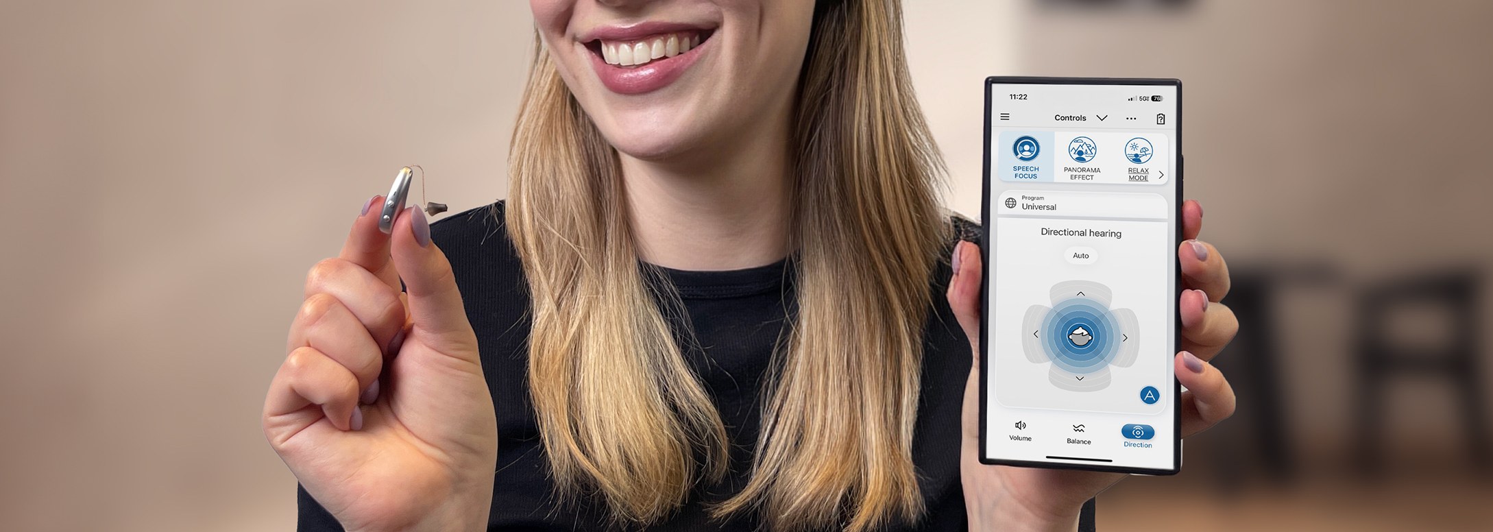 man connected hearing aids trough Smartphone
