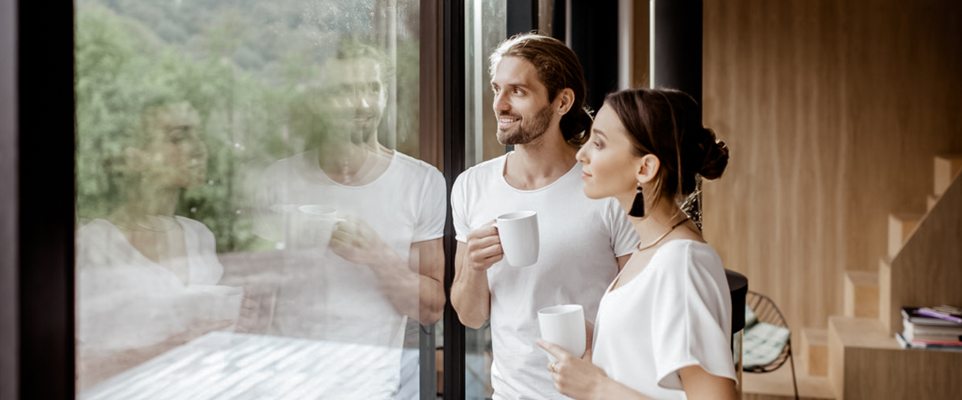 Couple looking out the window together