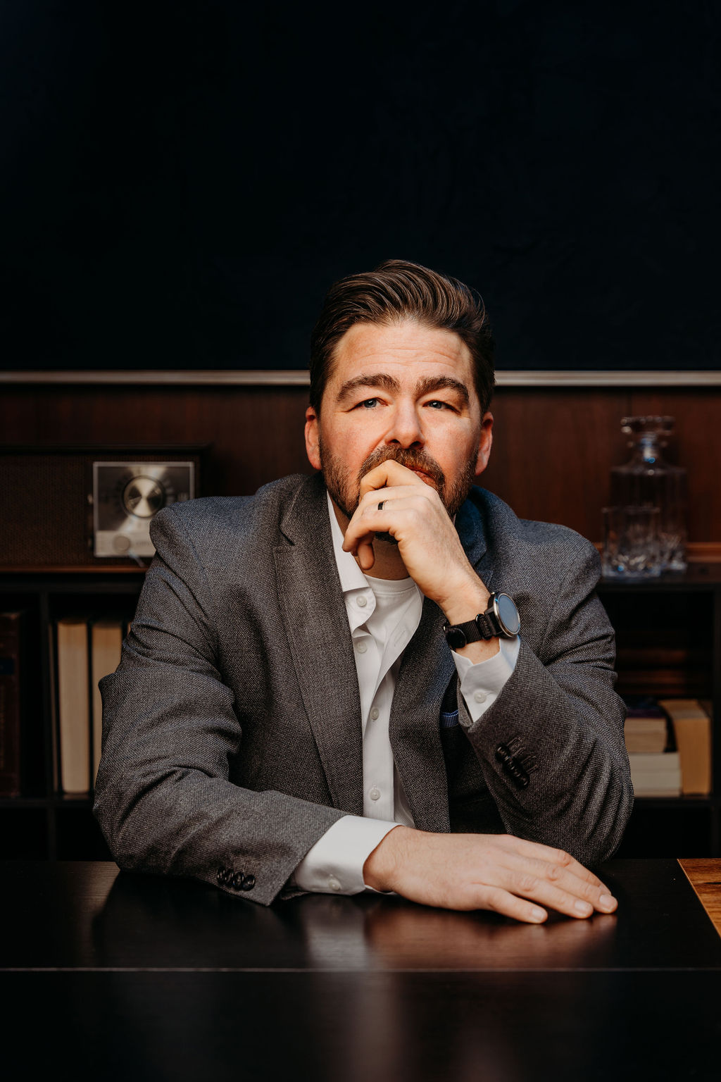 Joe Hungerman Sitting at Desk