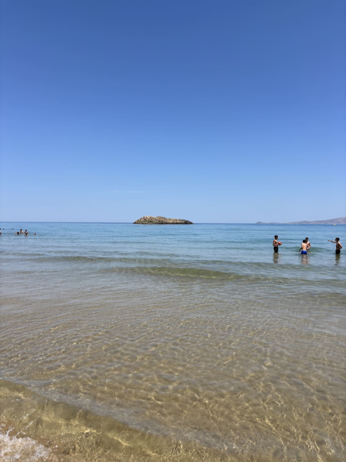 Pristine beach in Crete with crystal clear turquoise water and golden sand