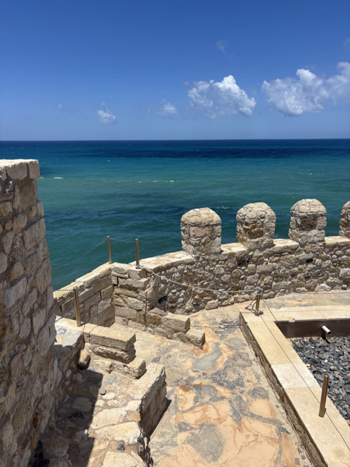 View of Heraklion port with historic castle walls and traditional Greek architecture