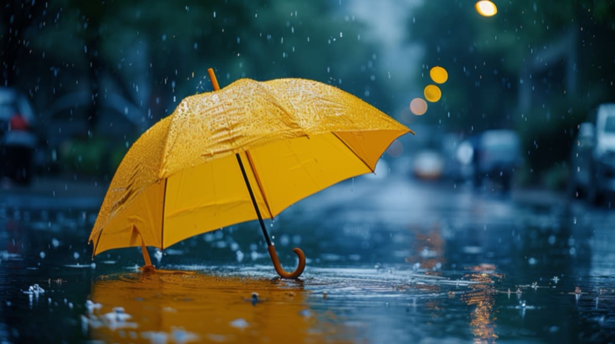 A reflection on how small acts of kindness, like a yellow umbrella, can create ripples of joy and connection in everyday life.