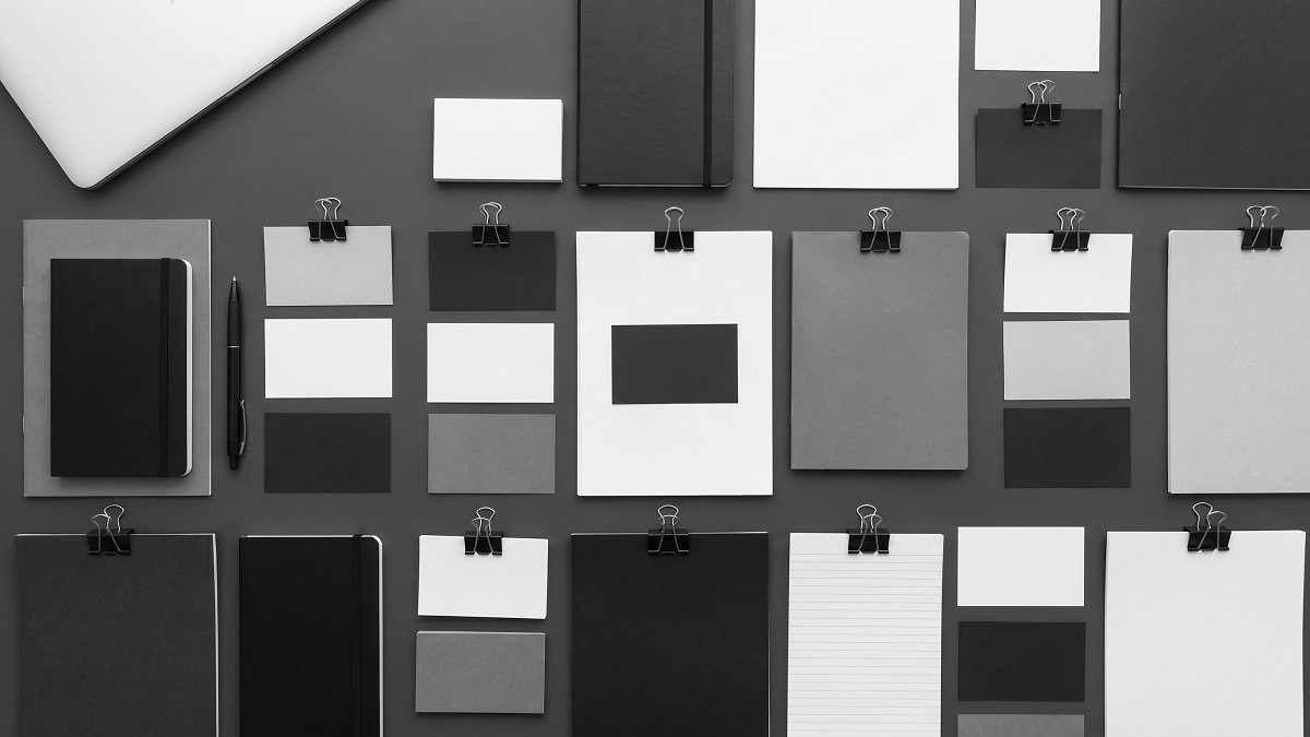 Project plan organised into three structured tiers on a desk