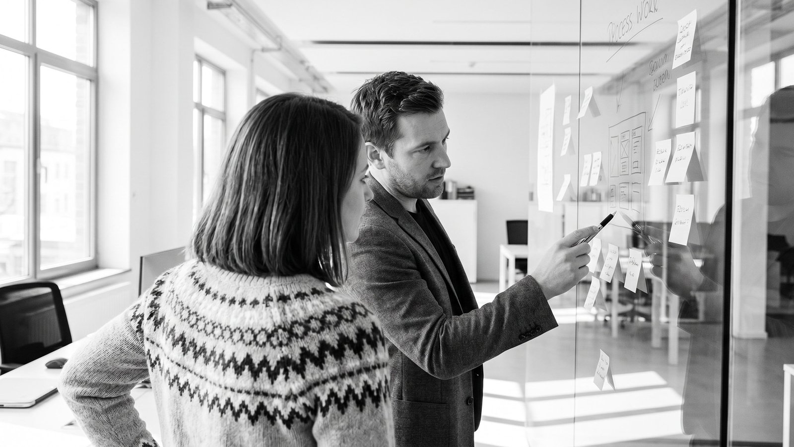 A founder and a senior fractional technology executive reviewing a product roadmap