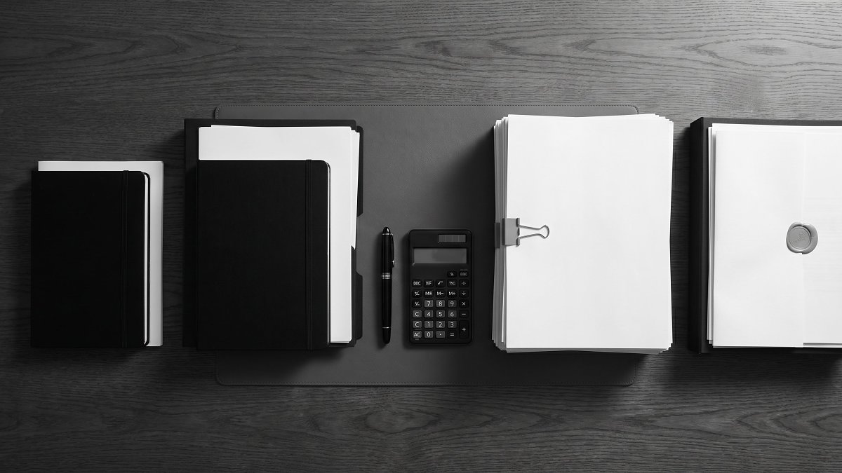 Four stacks of documents representing the hourly, daily, retainer, and equity fractional CTO rate models