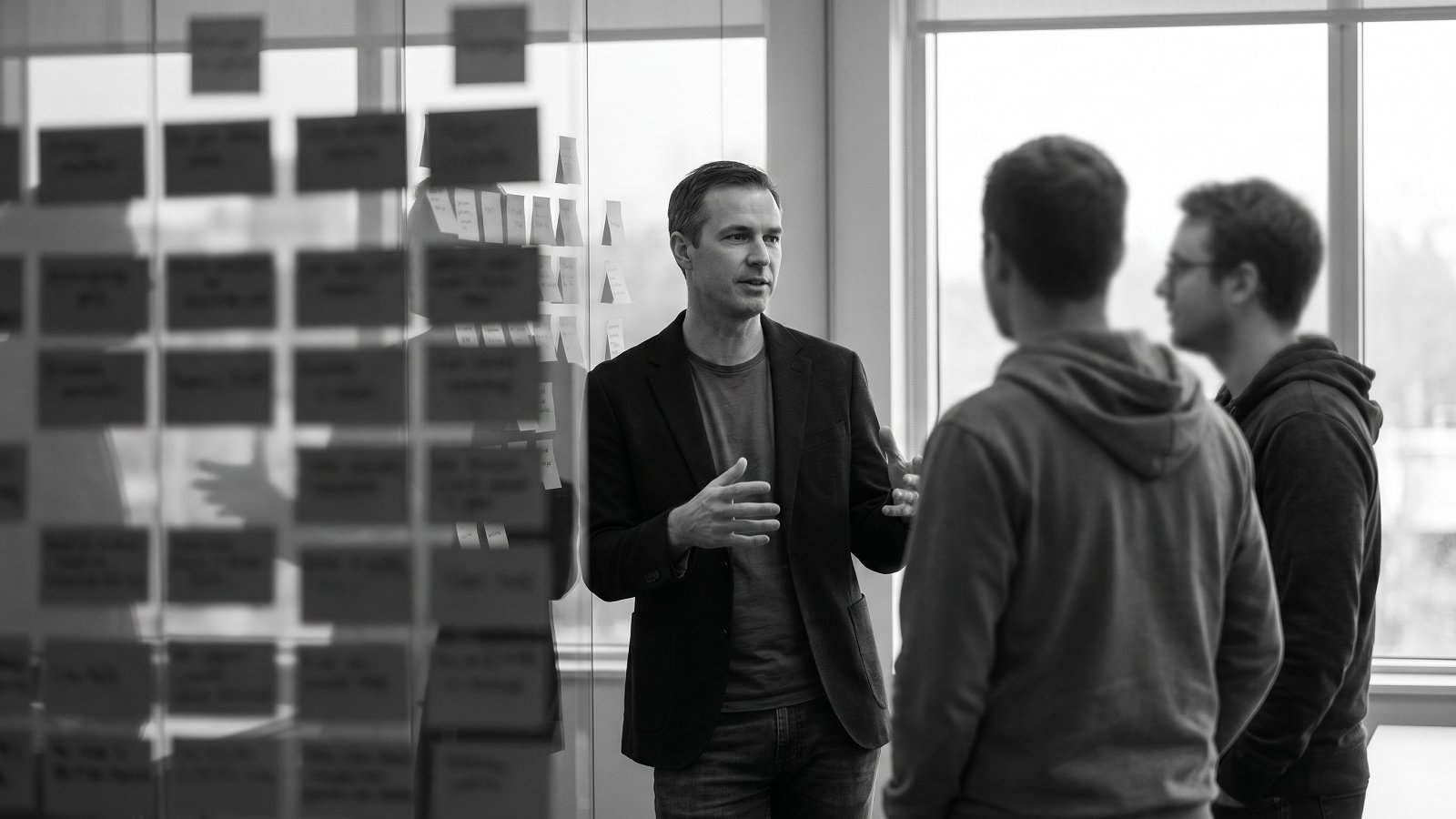 An interim head of engineering reviewing a delivery roadmap with a small engineering team