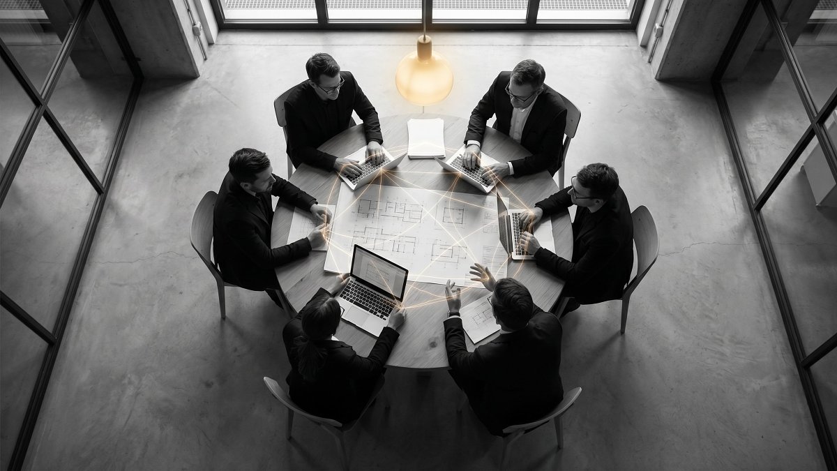 Overhead view of a seven-person engineering team connected by communication paths, illustrating optimal team size in engineering organization design