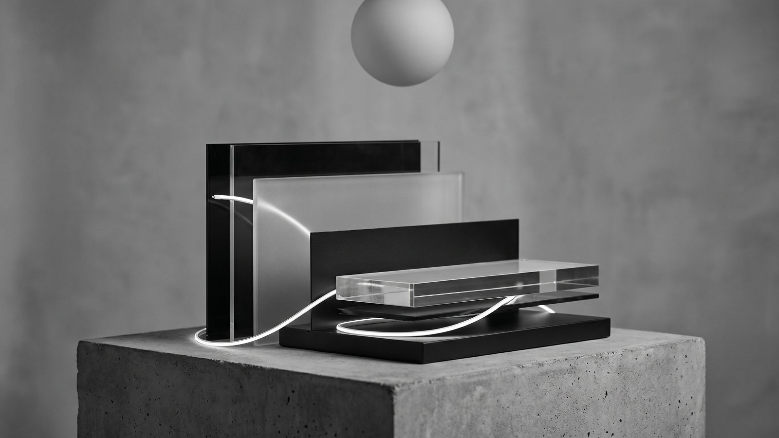 Layered glass and matte black panels representing an LLM application architecture stack