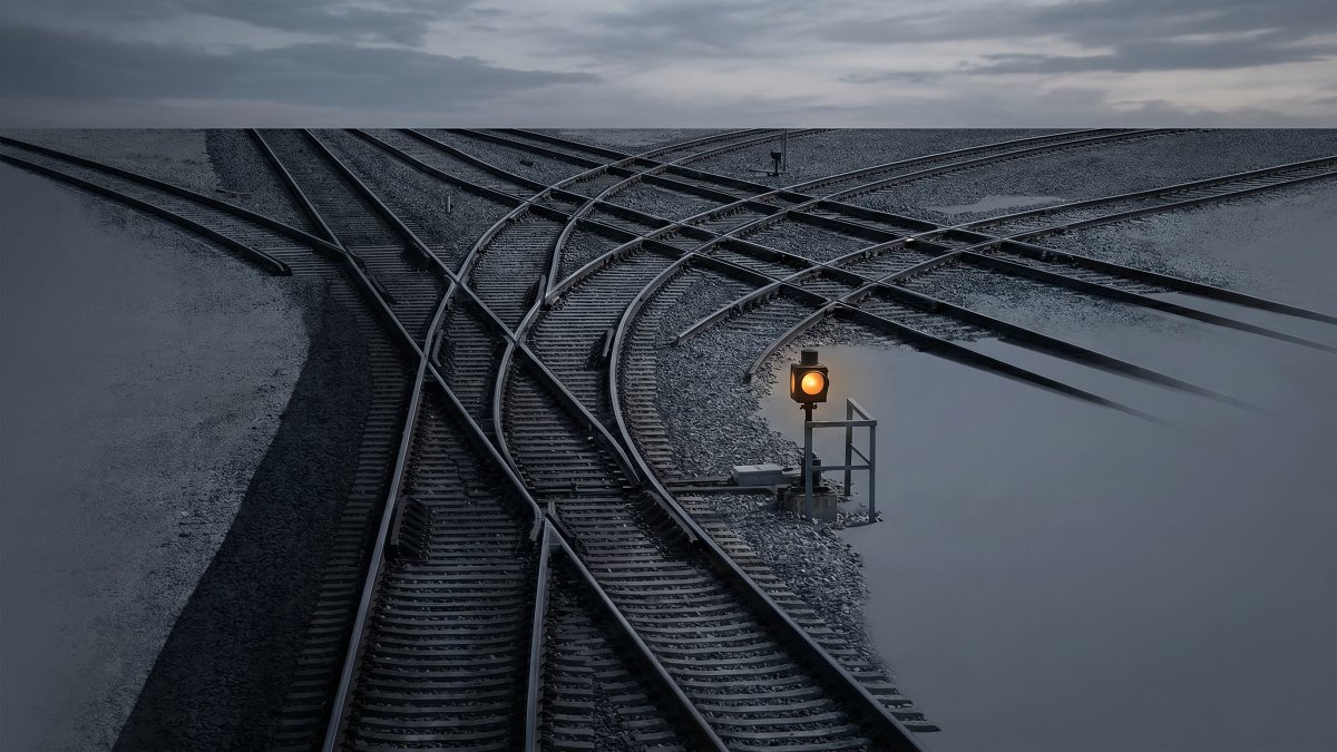 Railway switch yard where tracks diverge from one line, symbolizing model routing of requests