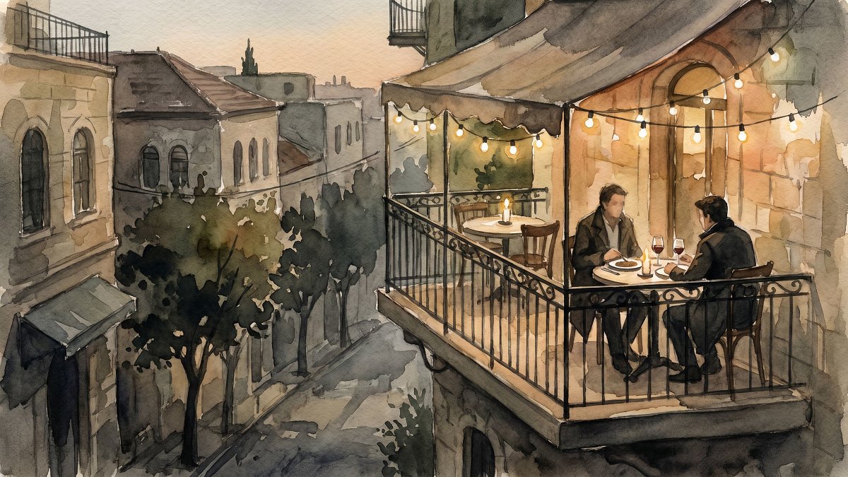 Balcony table at a kosher dairy bistro overlooking Emek Refaim in the evening