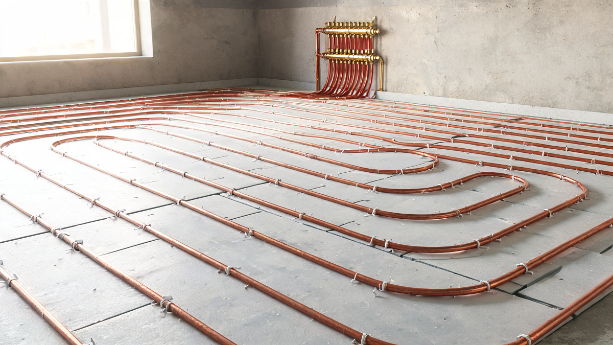 Boucles de plancher chauffant rafraîchissant fixées sur panneaux isolants avant coulage de la dalle
