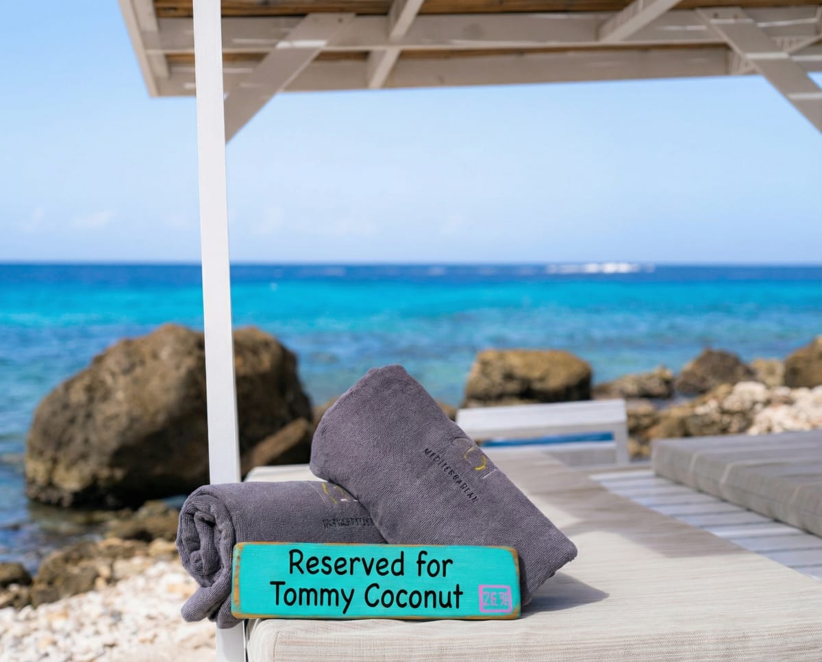 Tommy Coconut towels reserved beside the Caribbean Sea