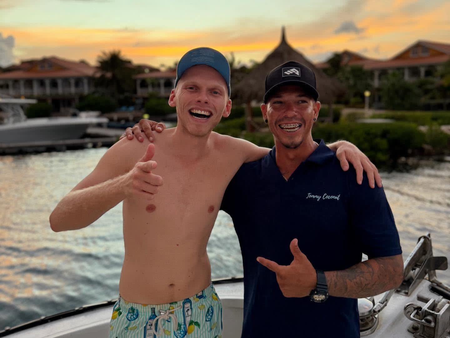 Captain Mike at the helm of his boat, looking confidently towards the horizon with a warm, genuine smile