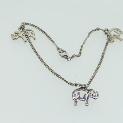 Silver necklace with elephants image