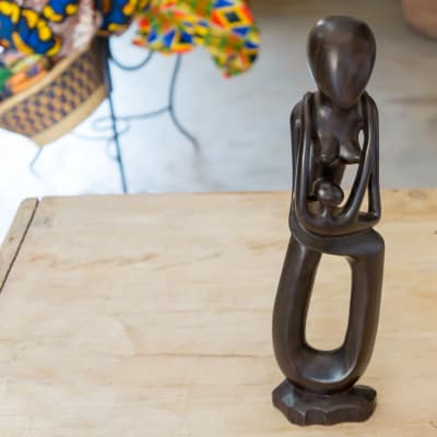 Wooden Curving of a Mother holding a Baby image