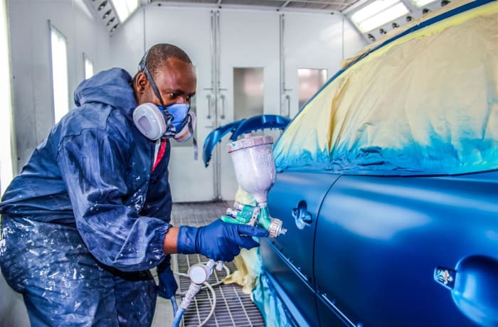 Car panel beating and spray painting image