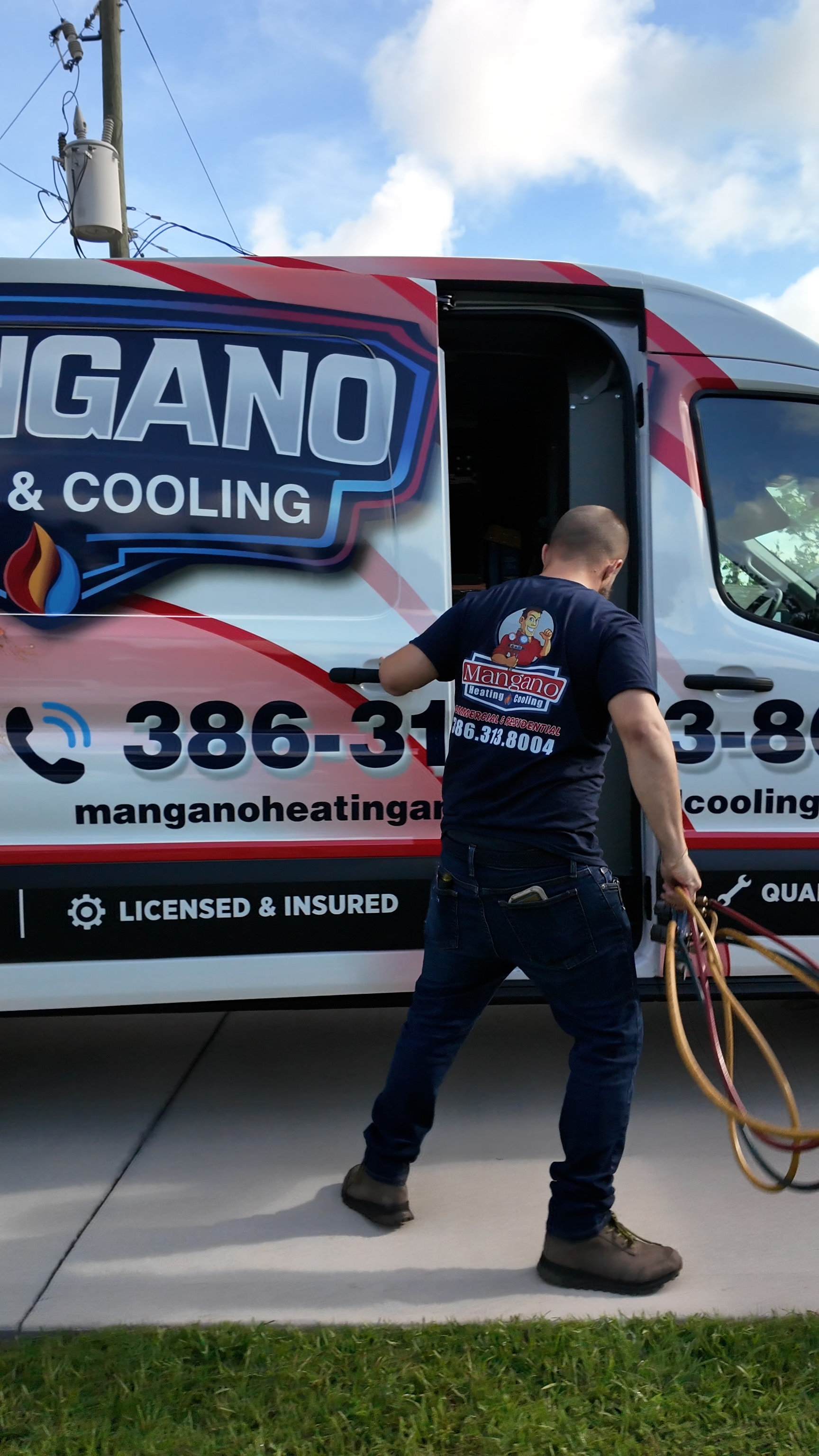 Mangano Heating & Cooling service van on the road in Flagler County, Florida