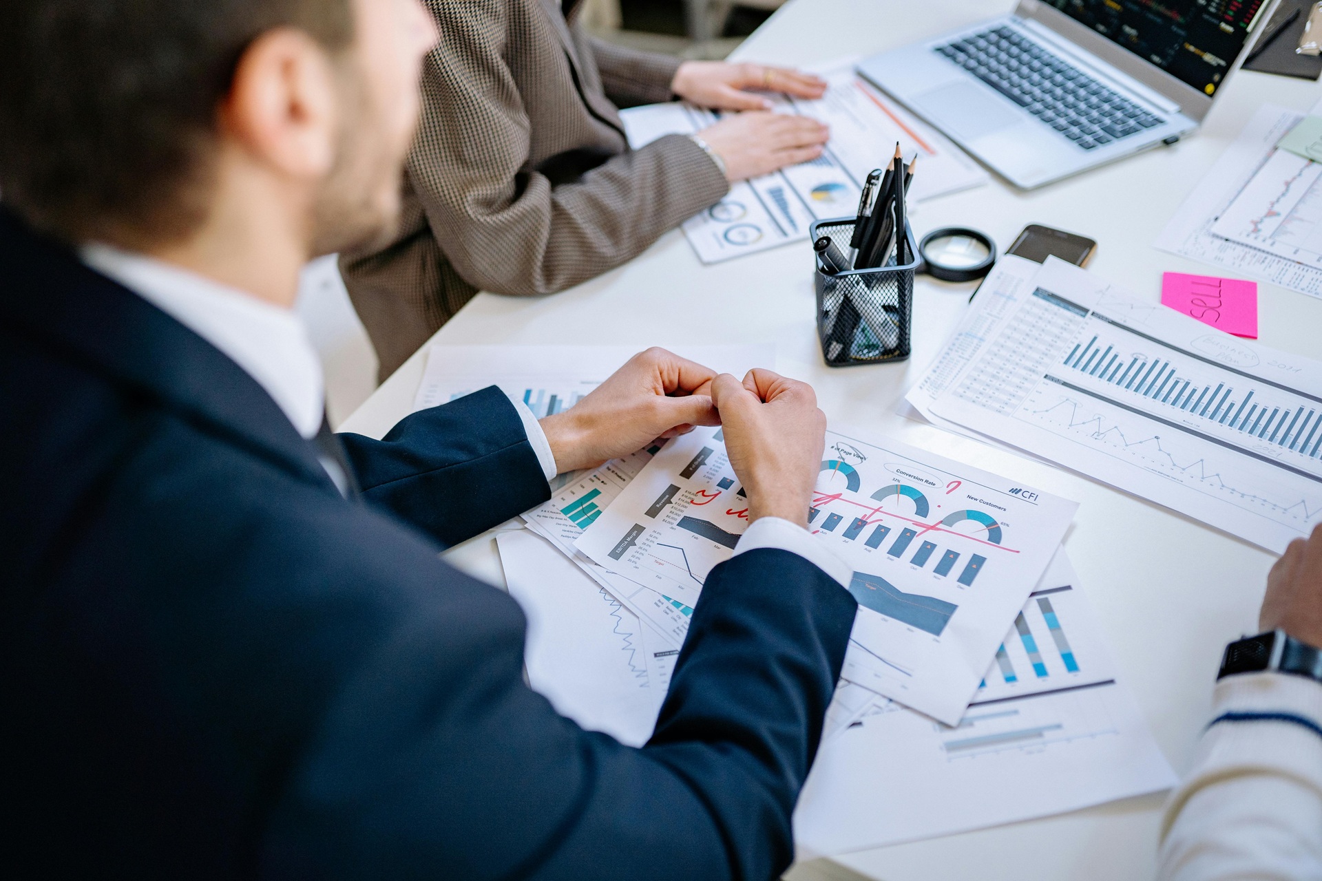 FinOps team reviewing financial data and charts