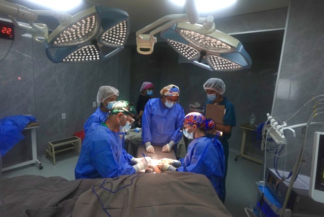 Visiting and local surgeons operating together