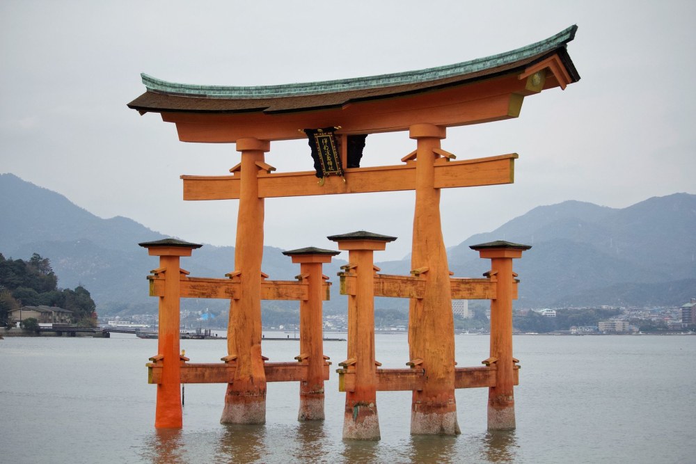 A torii gate standing in the water on the Japan group trip
