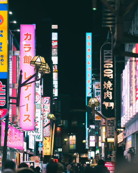 Neon-lit streets of Osaka at night