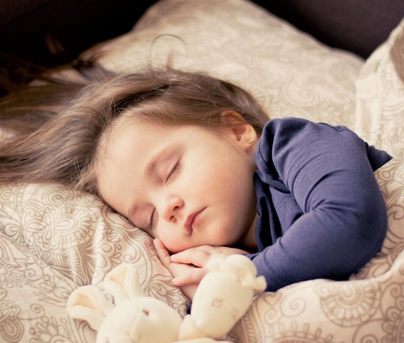 Baby girl sleeping peacefully, a portrait of restful child sleep