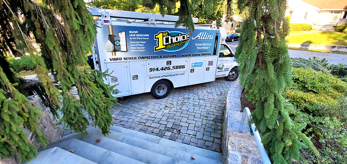 1st Choice service van wrap at a residential job site