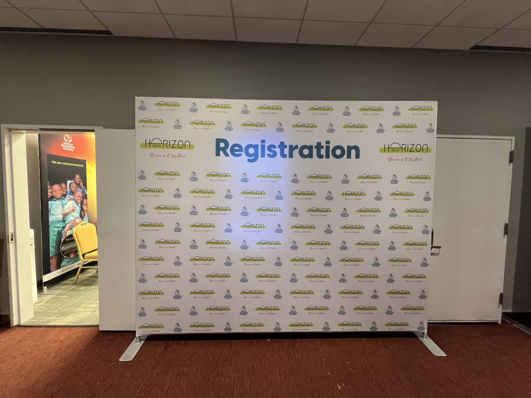 Horizon 2033 registration backdrop, a freestanding step-and-repeat with a large Registration header