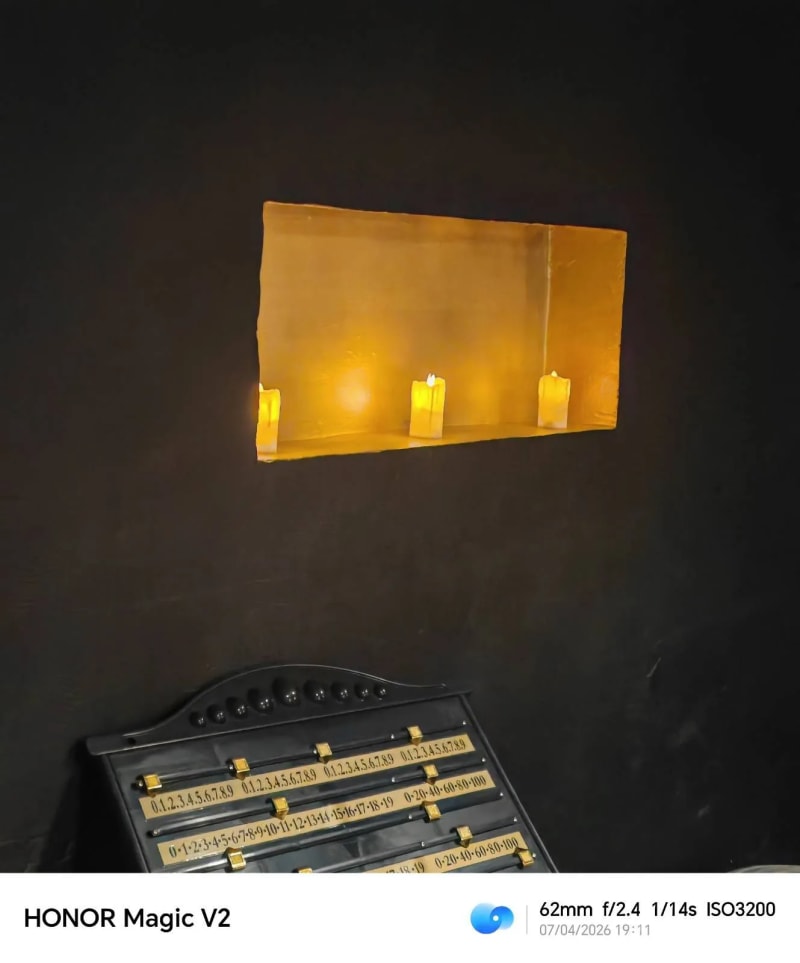 Candlelit wall niche with amber glow at El Tulipan Club