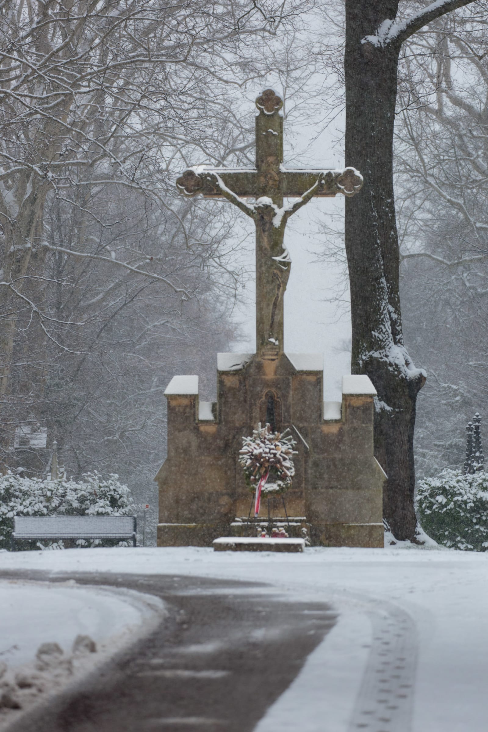 Stone Crucifix and Memorial Wreath