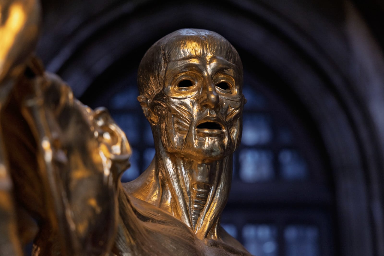 Gilded Bronze Figure with Pained Expression