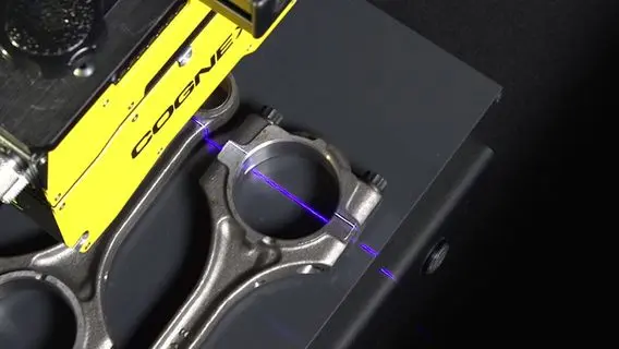 An AI-powered machine vision camera inspecting parts on a production line
