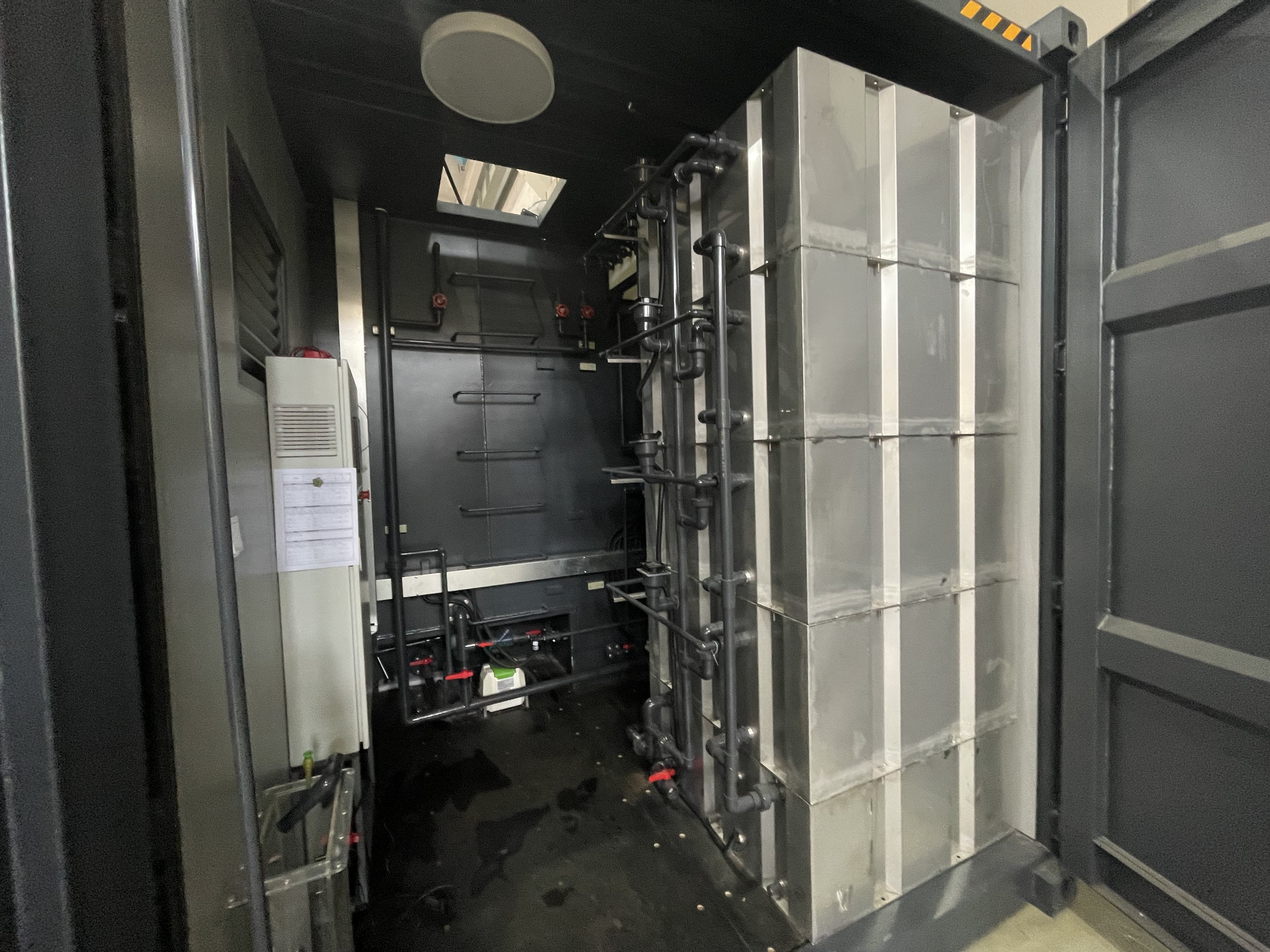 Treatment room with stainless steel tanks and piping