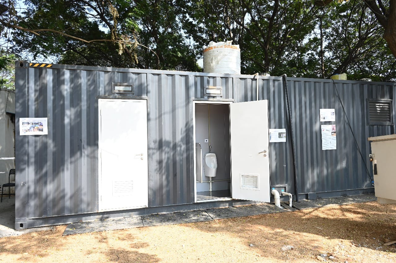 B-CRT container unit exterior at Lumbini Park showing toilet doors