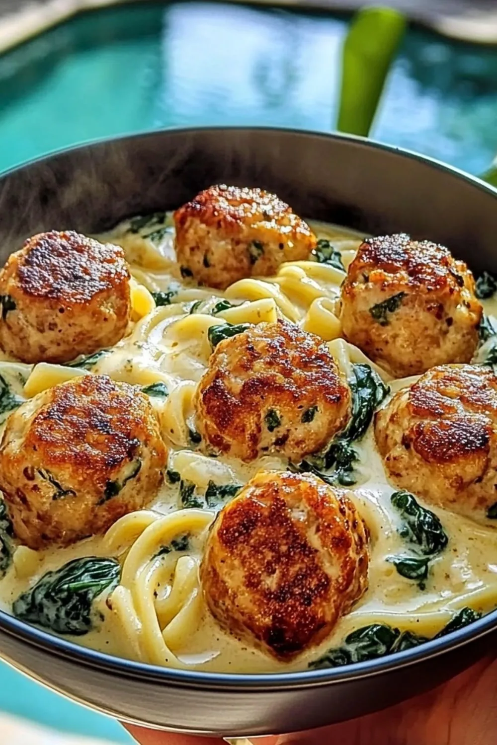 Delicious chicken ricotta meatballs in a creamy garlic spinach sauce