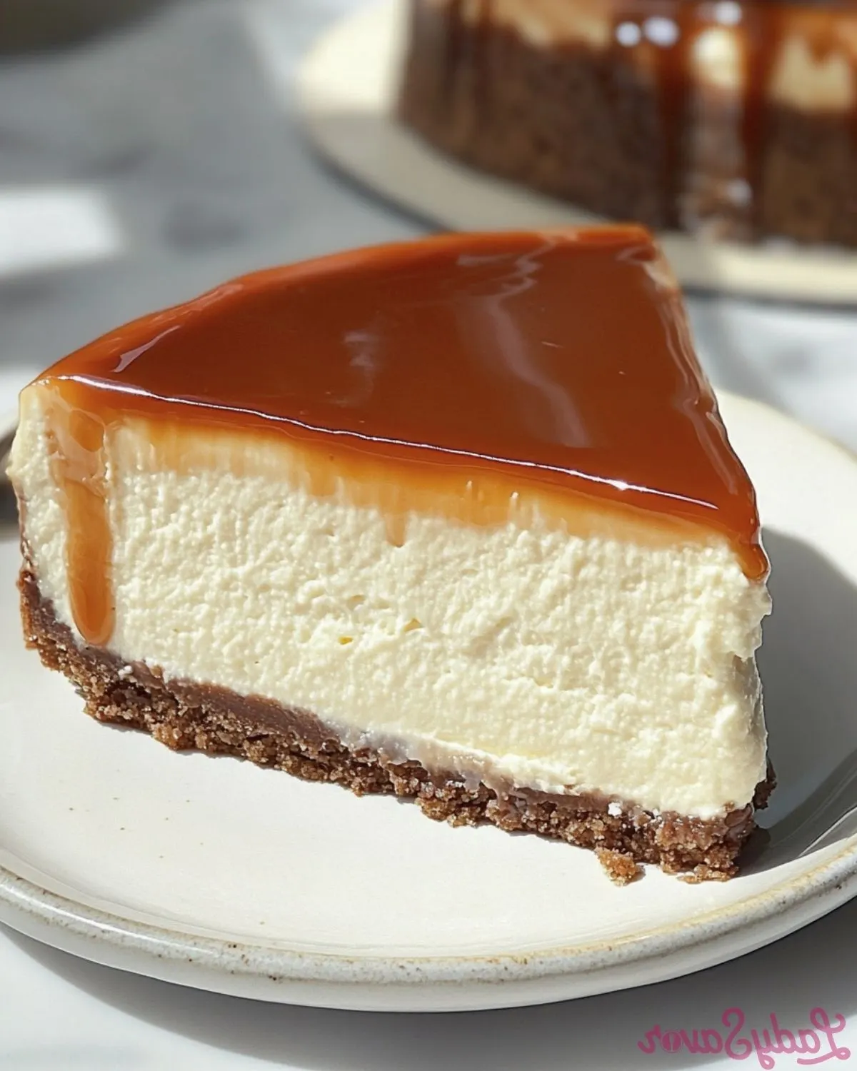 A slice of creamy cream cheese cake on a plate.