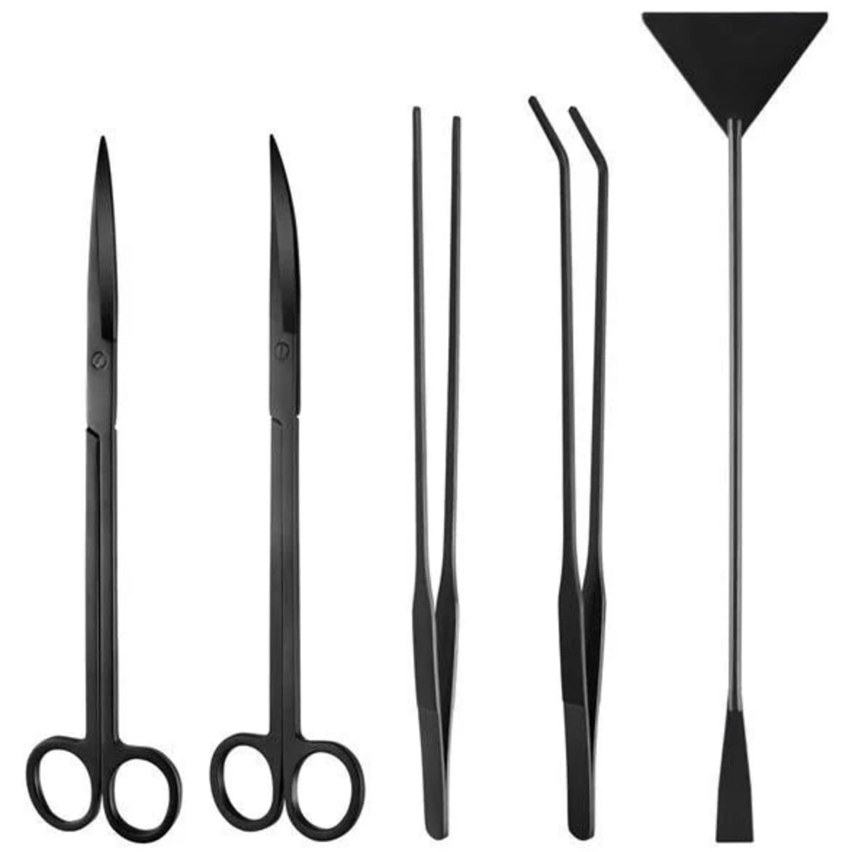 Collection of essential aquascaping tools including tweezers, scissors, and maintenance equipment for planted tanks