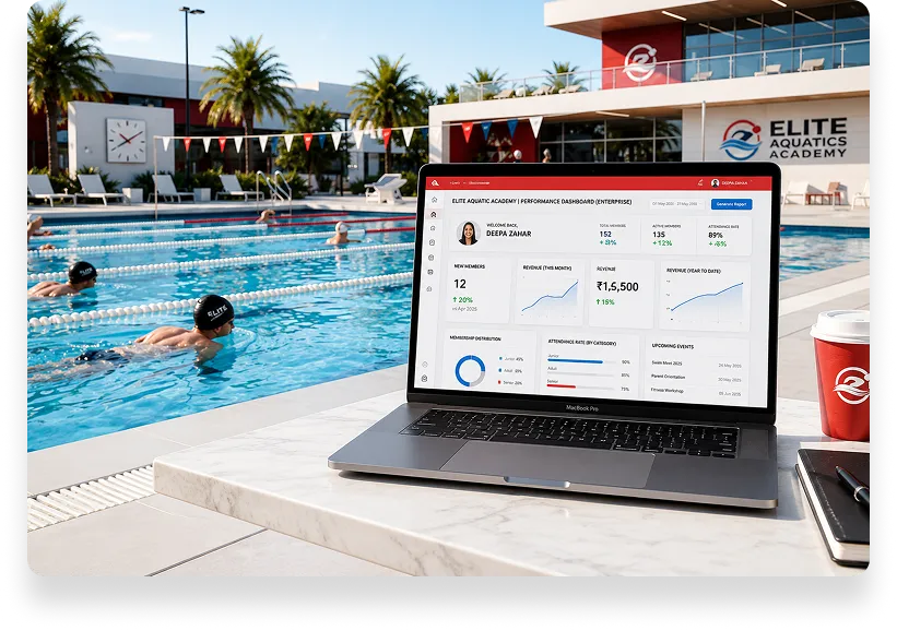 Laptop showing an Elite Aquatics Academy dashboard beside a swimming pool with swimmers training