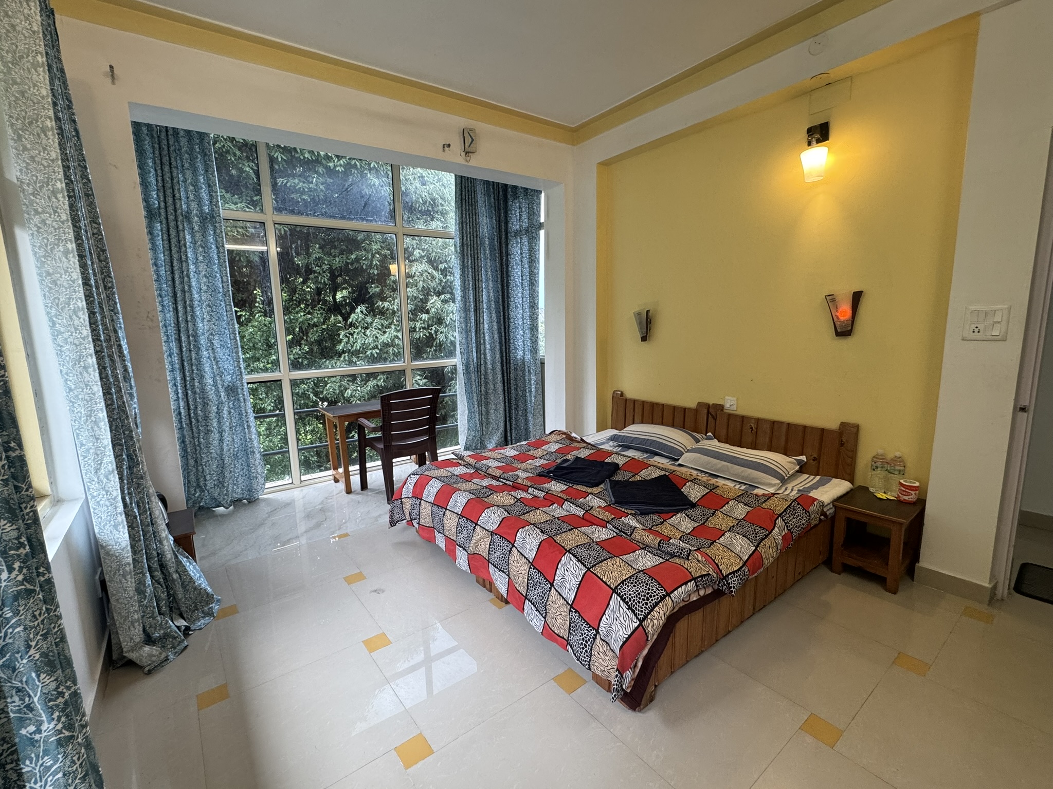 Luxury bedroom interior with a large window.