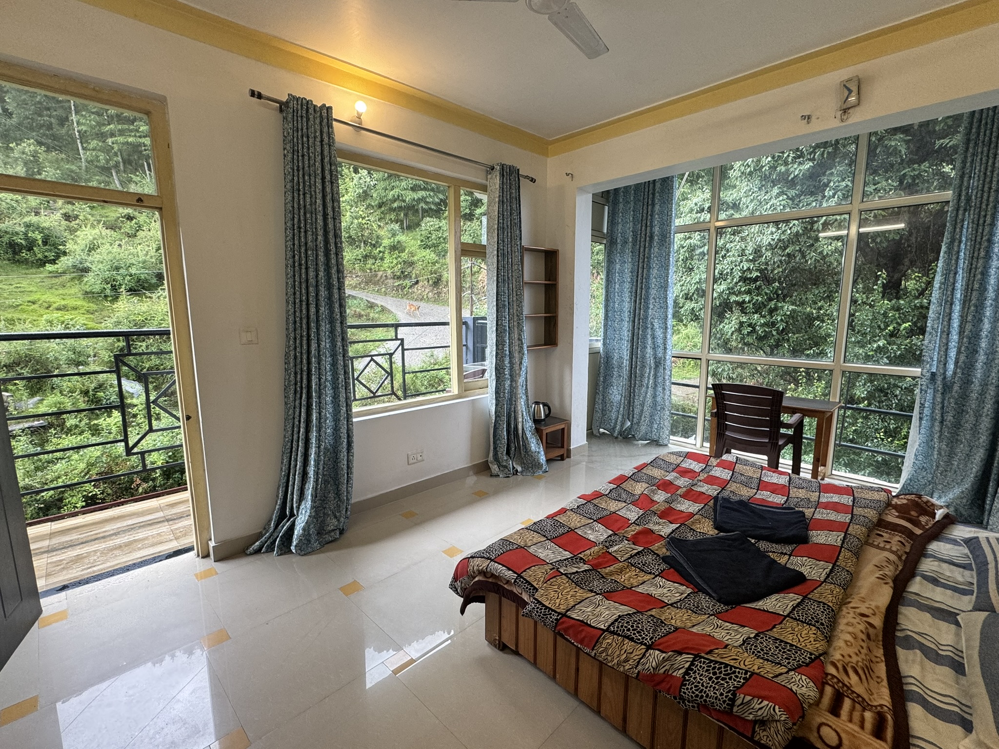 Modern bathroom with a valley view.