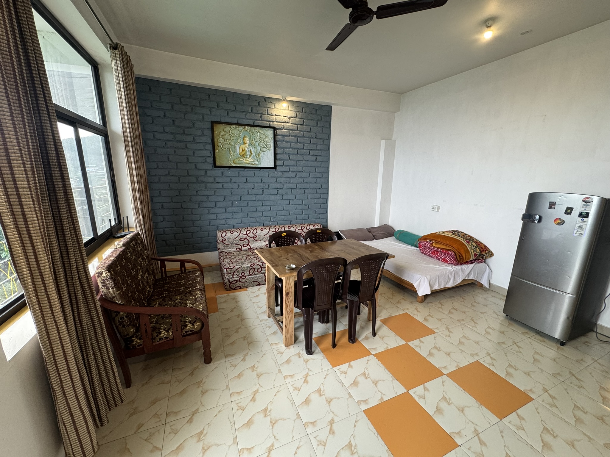 Living area of a suite with a panoramic city view.