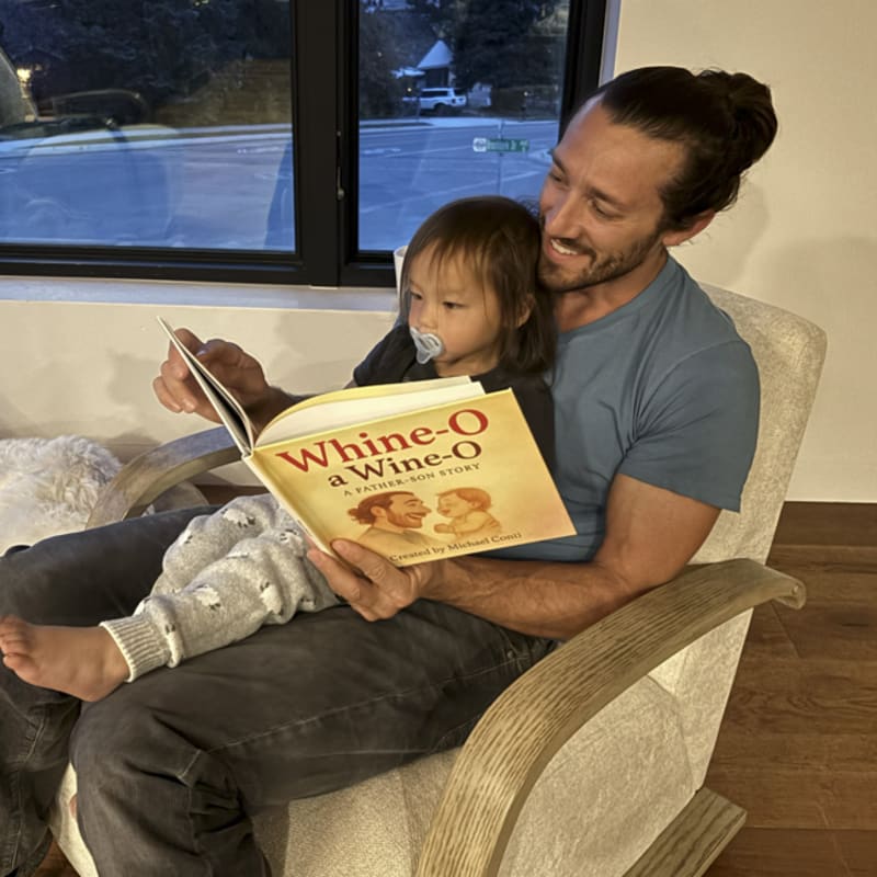 Michael and Cash reading their personalized storybook