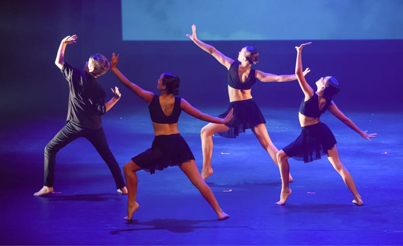 Contemporary Dancers performing on stage at Ikin Dance showcase