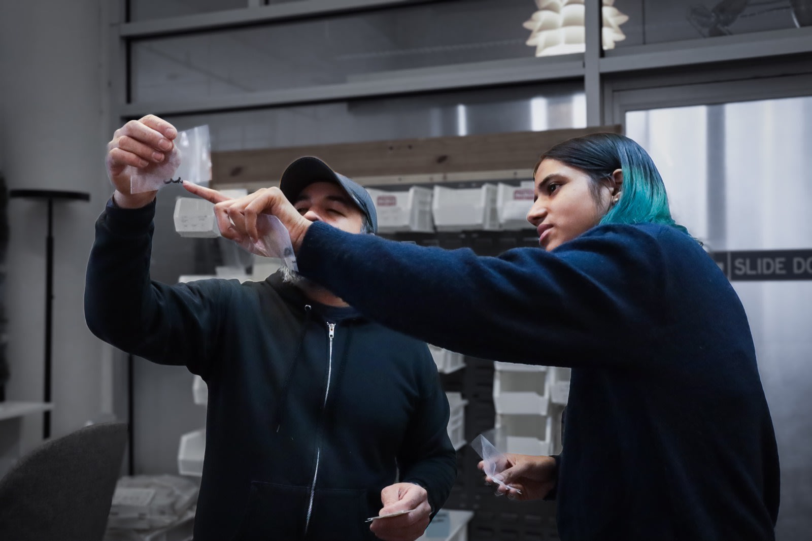 Makelab team inspecting 3D printed parts