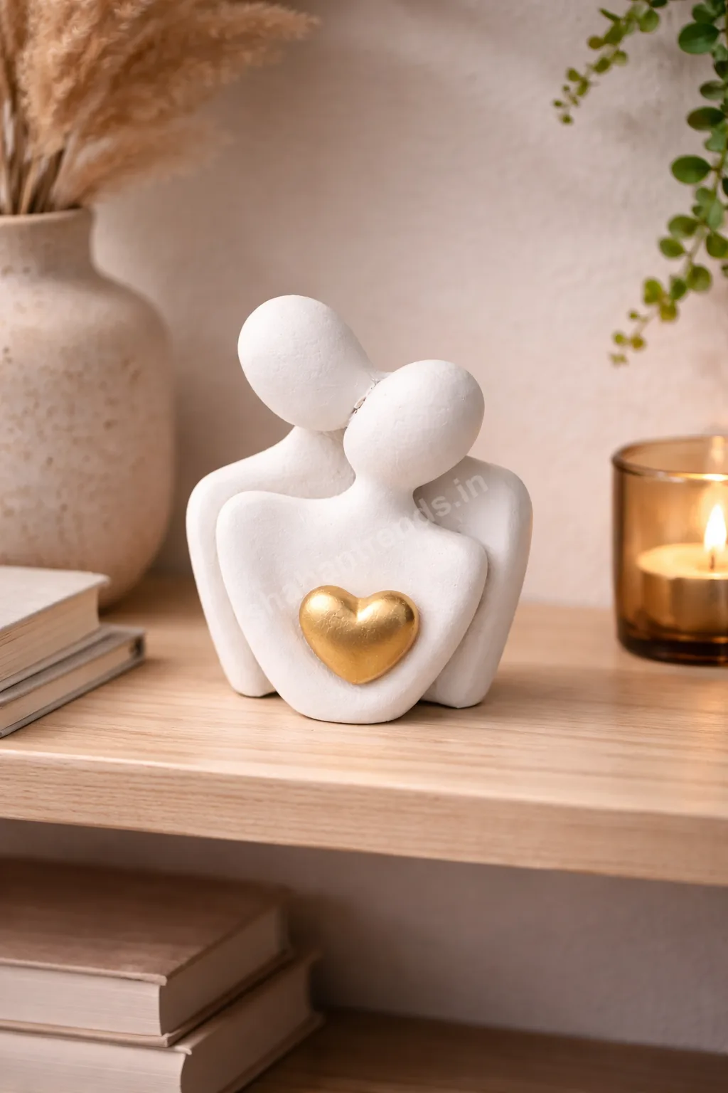 couple statue with golden heart