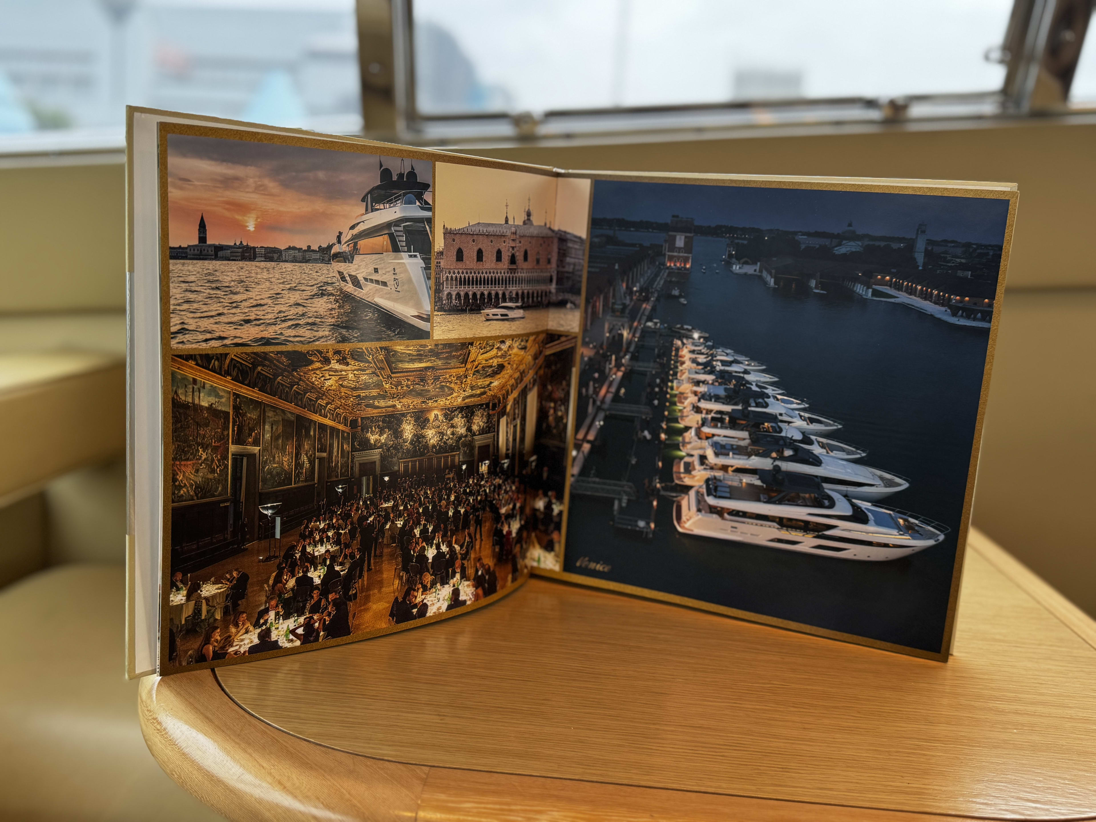 Printed book showing formal dining events, a luxury yacht fleet and Venice waterfront scenes