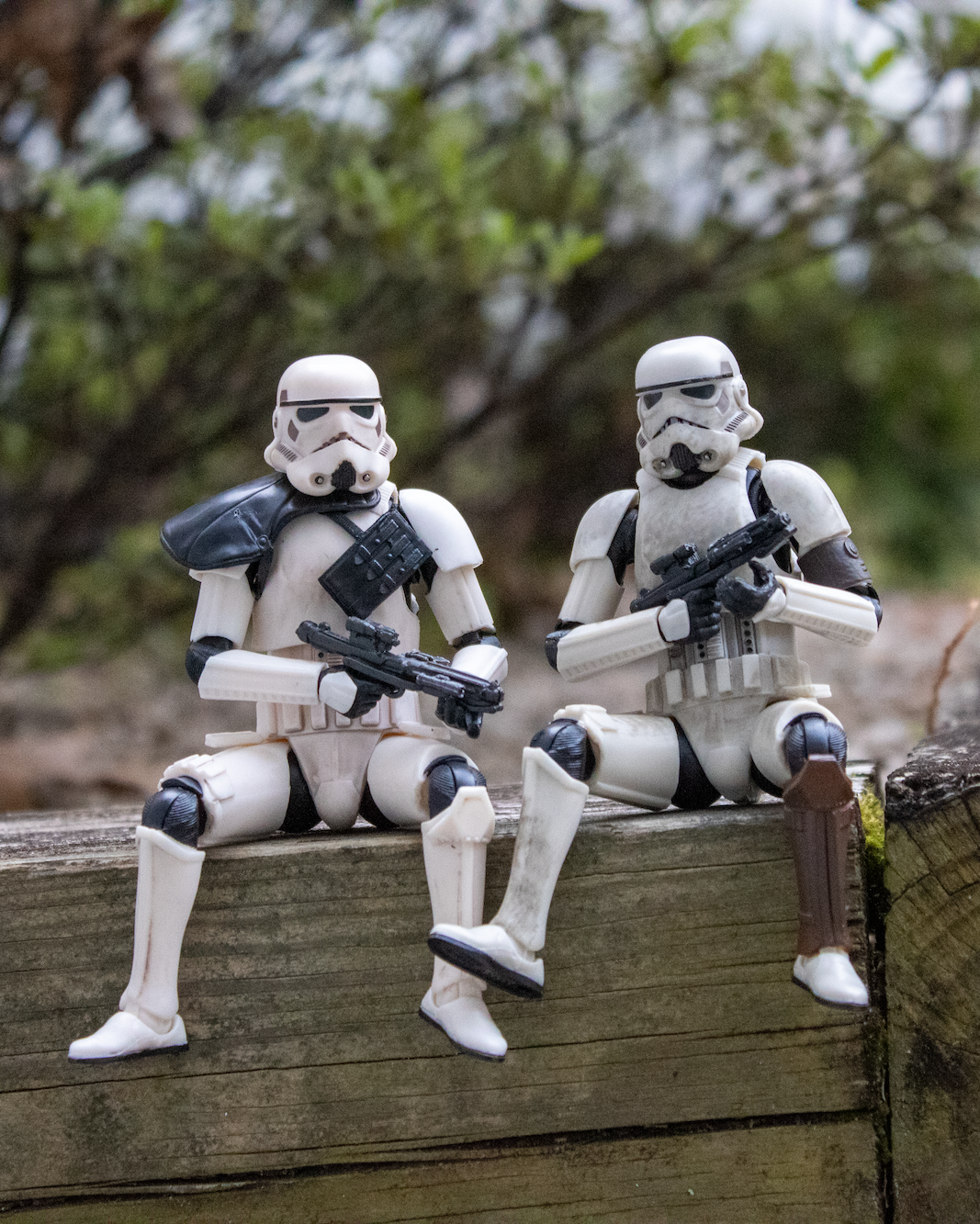 Storm Trooper action figures sitting together outside