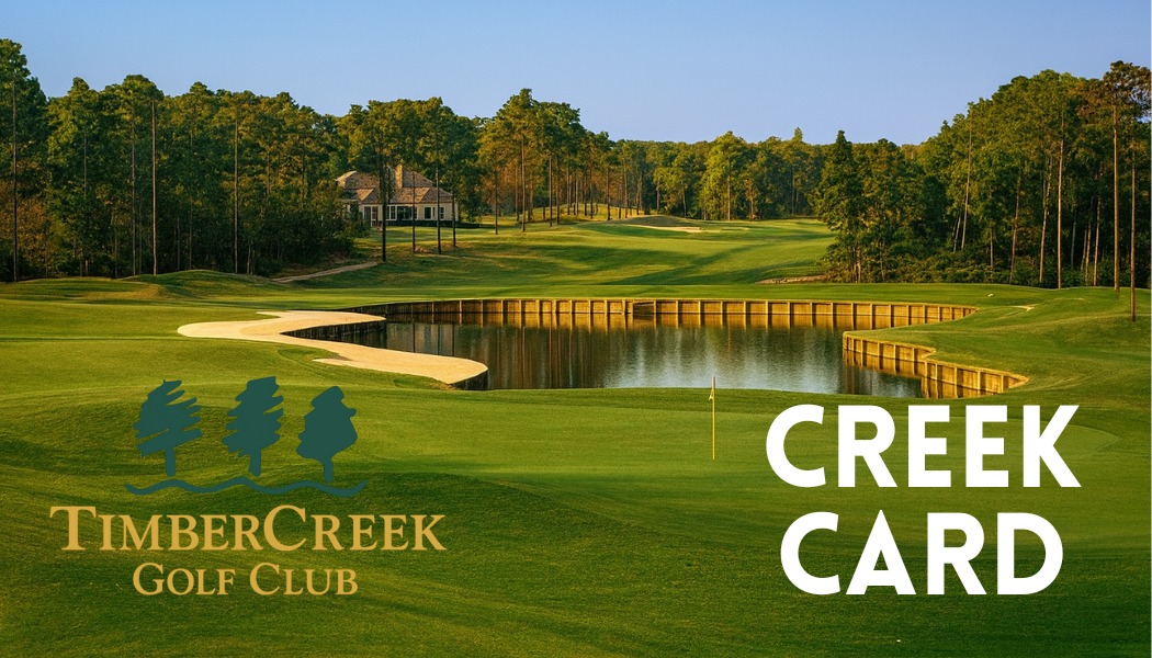 Stunning golf course promotional image featuring a water hazard with wooden retaining wall, pristine green, clubhouse in background, and TimberCreek branding with 'CREEK CARD' text overlay.