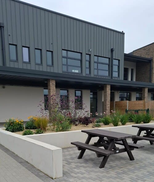 School with plants in front of it planted by Eire Landscapes Tipperary