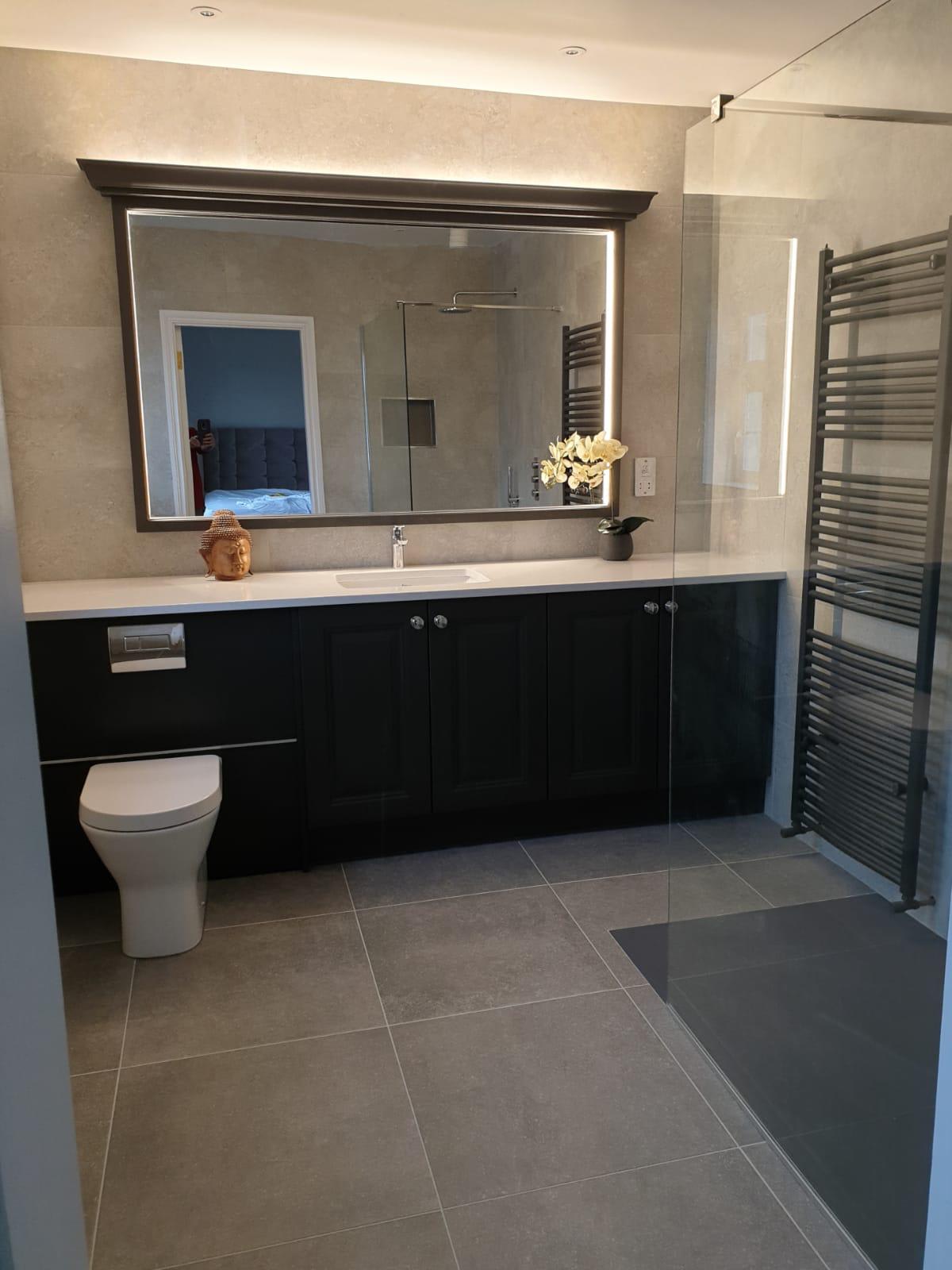 picture of a bathroom recently renovated with tiled walls and floor.